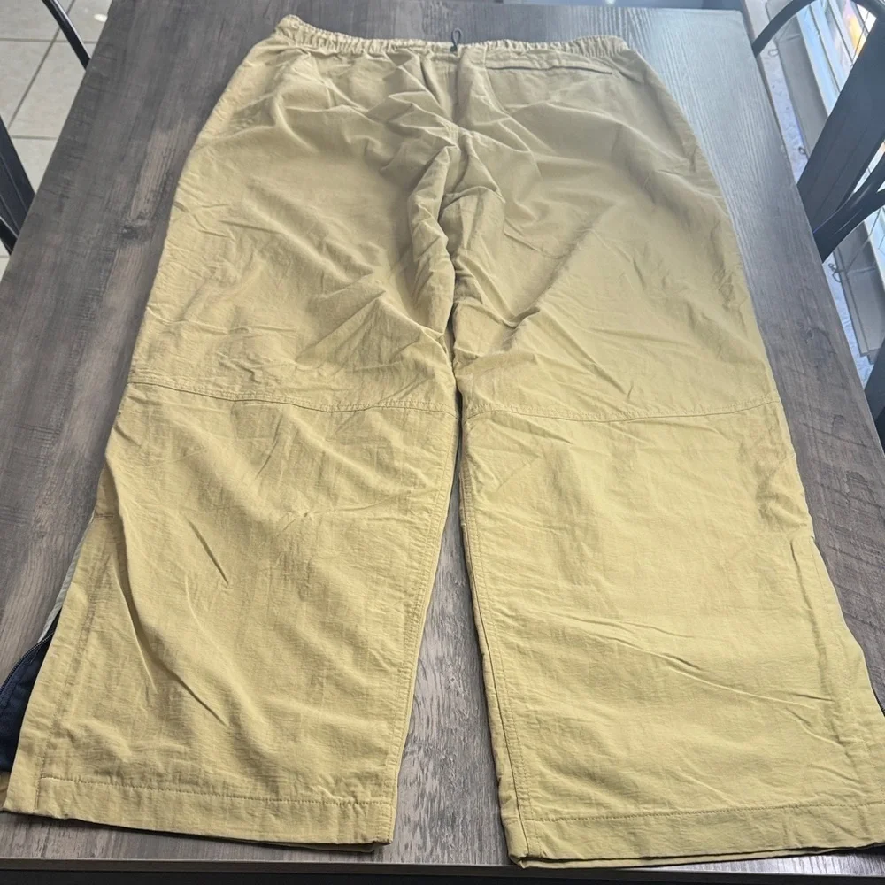 Vintage 90’s  Y2K Abercrombie and Fitch tan track pants with white stripes.